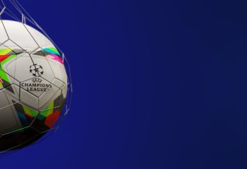 Guilherand-Granges, France - August 30, 2022. UEFA Champions League. Soccer ball in net with official logo of the UEFA Champions League. 3D rendering.